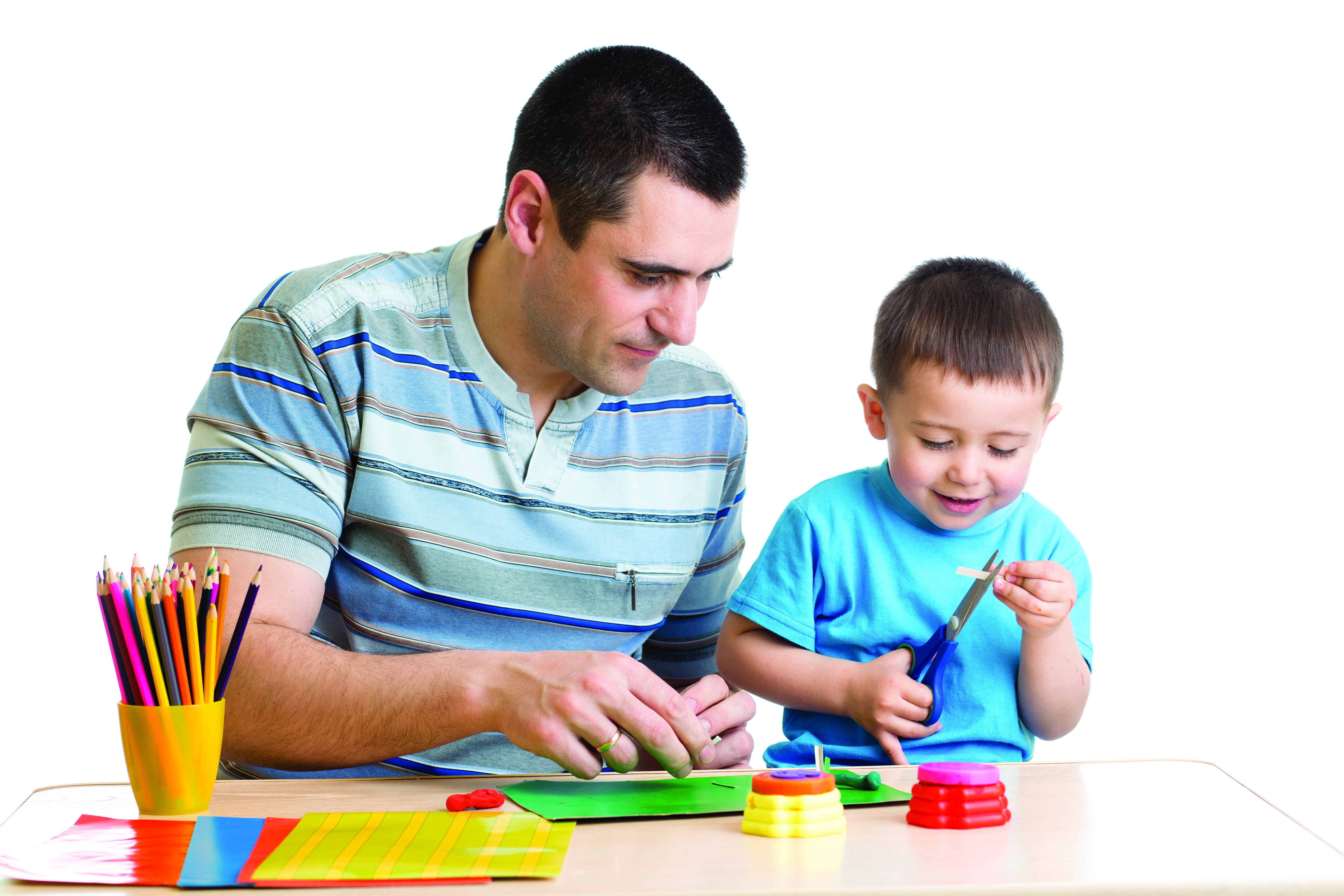 A father and son are working on a craft together.